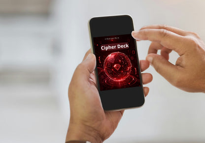 A person holding a smartphone that displays a red digital cover titled 'Cipher Deck' with a glowing cryptographic orb graphic. The other hand is touching the screen.